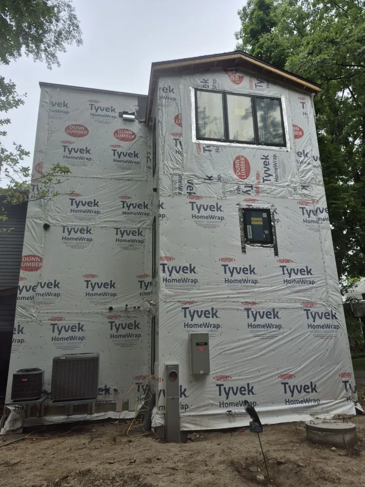 Before: side wall in housewrap