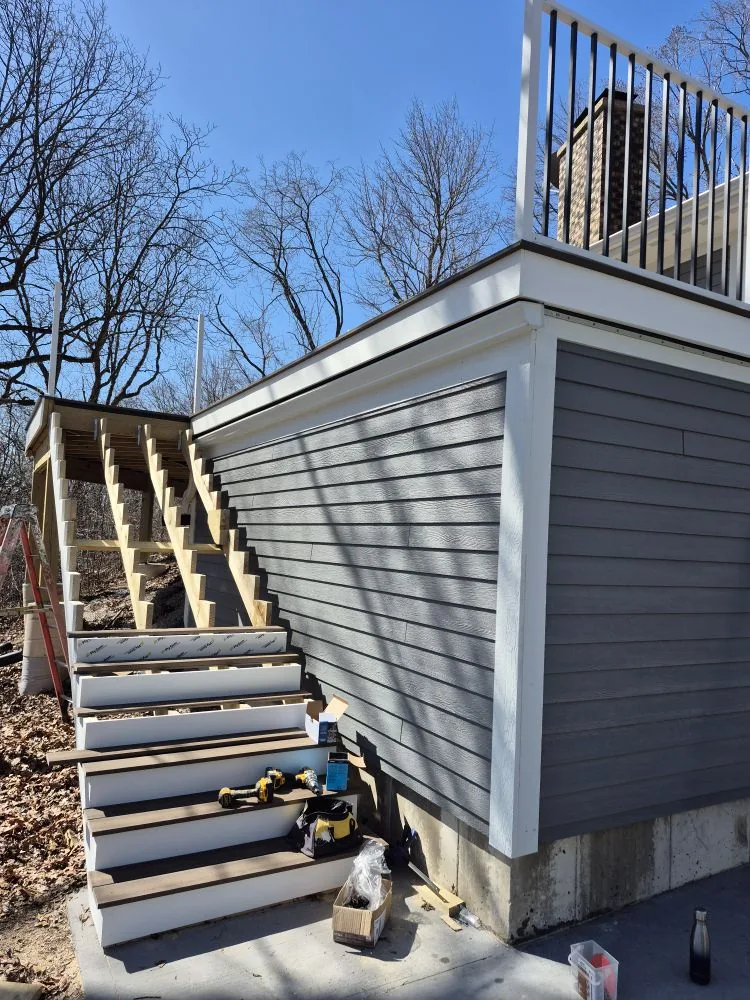 Stairs going in beside the AZEK deck skirt